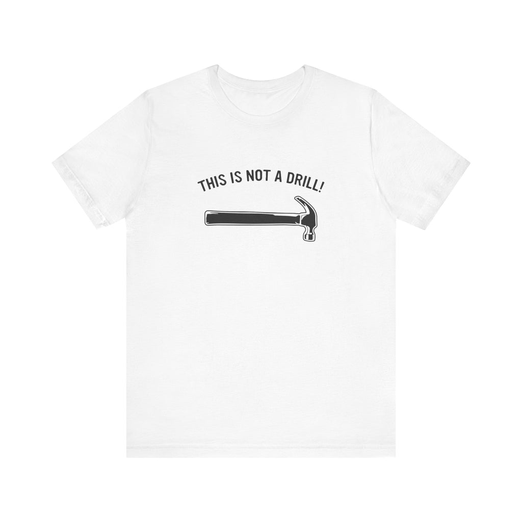 White t-shirt with 'THIS IS NOT A DRILL!' text and hammer graphic on a white background